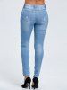 Light Wash Distressed Jeans -  