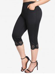 Plus Size Pockets Hollow Out Capri Leggings -  