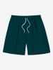 Tenue de plage hawaïenne assortie grande taille avec imprimé de branches de fleurs et éclaboussures de peinture à l'encre pour couples - Vert 