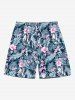 Tenue de plage hawaïenne assortie grande taille à imprimé feuilles tropicales et fleurs d'hibiscus pour couples - Bleu 