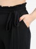 Ensemble grande taille composé d'un haut asymétrique à épaules dénudées, lacé et orné de sequins scintillants, et d'un pantalon large à volants. - Bleu profond 