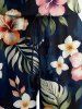 Combinaison hawaïenne grande taille à imprimé de feuilles tropicales et d'hibiscus, avec cordon de serrage et poches. - Noir 3X