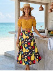 Ensemble grande taille composé d'un haut uni à taille cintrée et d'une jupe trapèze fendue à imprimé ananas, hibiscus et papillons (style hawaïen). Disponible en plusieurs tailles. - Jaune 