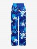 Pantalon tuyau de poêle hawaïen à imprimé cocotier, feuilles tropicales et éclaboussures de peinture - Bleu XS